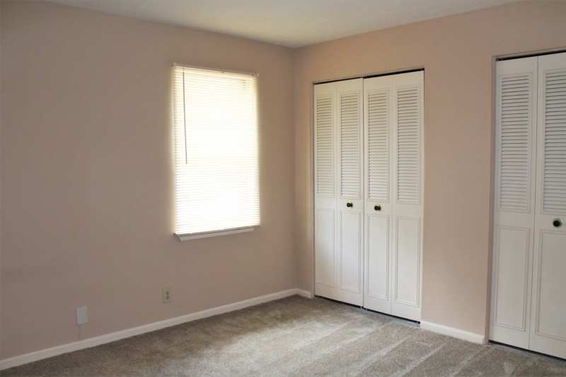 Bedroom with double closets